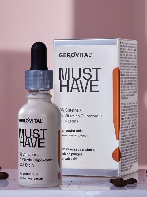 Gerovital Must Have Eye Contour Serum bottle and box beside coffee beans