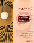 Close-up of Aslavital Cleansing Emulsion bottle beside a white cream droplet on a gold-colored surface