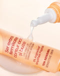 Aslavital Extra Firming Eye and Lip Contour Serum tube beside its nozzle dispensing white serum
