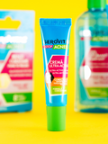 Gerovital Acne Stop Ultra Active Cream tube against a yellow background with other Acne Stop products