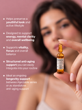 Woman holding a Gerovital amber ampoule beside promotional text on a pink background