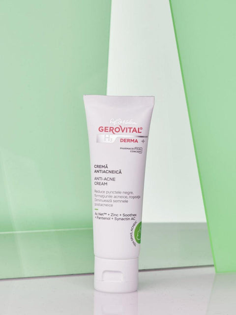Gerovital H3 Derma+ Anti Acne Cream white tube against green panels