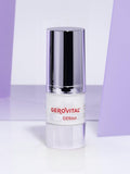 Gerovital H3 Derma+ Anti-Wrinkle Eye Contour Cream dispenser with silver cap against purple panels