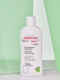 Gerovital H3 Derma+ Purifying Foaming Gel white bottle against green panels