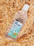 Gerovital H3 Hyaluron C Micellar Water bottle on pale wood shavings