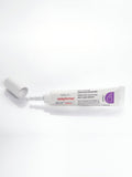 Uncapped Gerovital Ceramide Booster Serum tube lying on white