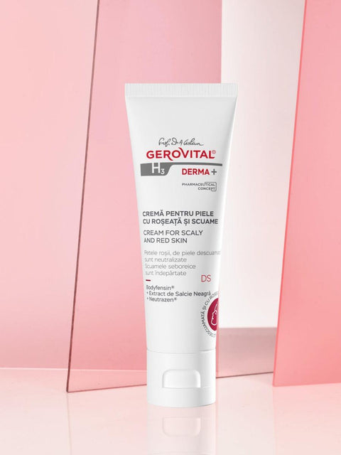 Gerovital H3 Derma+ Cream for Scaly and Red Skin tube against pink panels