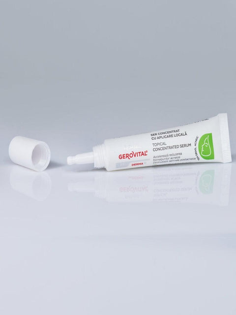 Uncapped Gerovital Derma+ Topical Concentrated Serum tube lying on white
