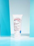 Gerovital Derma+ Ultra-Moisturizing Hand Cream tube against turquoise panels