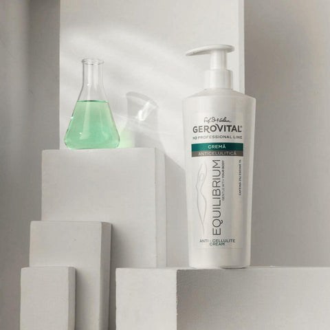 Gerovital Equilibrium Anti-Cellulite Cream bottle among white blocks and a green flask