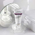 Gerovital Equilibrium Anti-Wrinkle Eye Cream tube on clear dish beside mirror