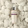 Gerovital Equilibrium Dark Spot Correcting Serum bottle among white stones