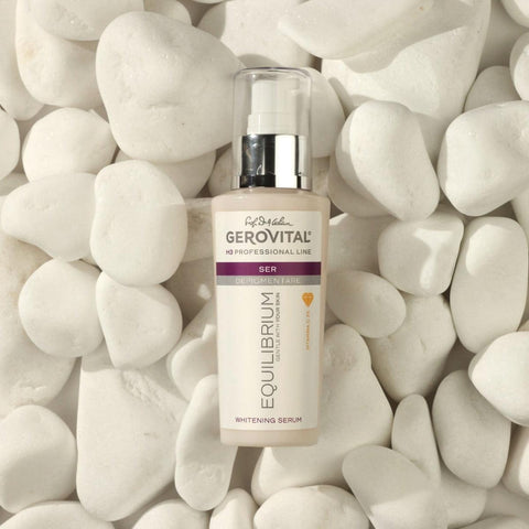 Gerovital Equilibrium Dark Spot Correcting Serum bottle among white stones