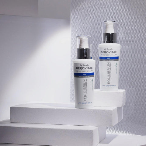 Two Gerovital Equilibrium Lift Expert Serum bottles on white steps