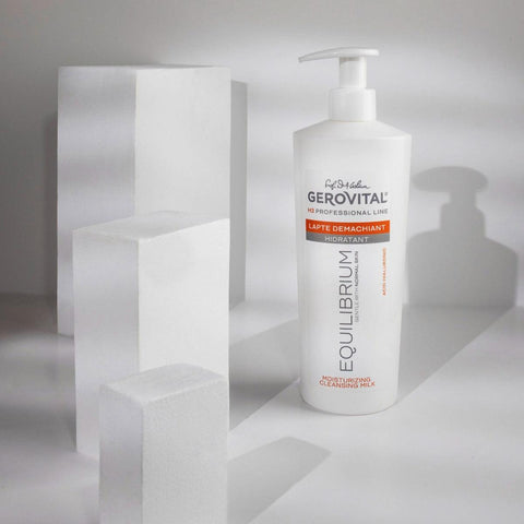 Gerovital Equilibrium Hydrating Cleansing Milk bottle beside white blocks