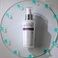 Gerovital Equilibrium Hydrating Serum bottle on glass dish ringed with turquoise beads
