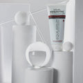 Gerovital Equilibrium Anti-Couperose Forte Cream tube among white shapes and clear sphere