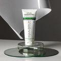 Gerovital Equilibrium Mattifying Sebum Control Cream tube on clear dishes and mirror