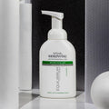 Gerovital Equilibrium Micellar Cleansing Foam pump bottle against black mesh