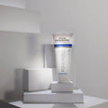 Gerovital Equilibrium Nourishing Massage Cream tube on white blocks