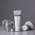 Gerovital Equilibrium Repairing Mask tube on mirror beside clear spheres