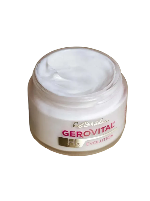 Open Gerovital H3 Evolution cream jar showing the white cream on a gold-colored surface