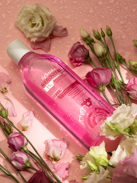 Gerovital H3 Evolution Wild Rose Oil Micellar Water bottle among pink and white flowers