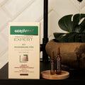 Gerovital Hair Expert Hair Regeneration Treatment Kit box and two ampoules beside a potted plant