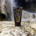Gerovital Hair Expert Argan Moisturizing Hair Mask tube on wet rock