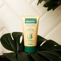 Gerovital Hair Expert Keratin Co-Wash Revitalizer Shampoo tube standing on green leaves