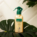 Gerovital Hair Expert Keratin Nutritive Balm spray bottle standing on green leaves