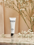 Gerovital Luxury Final Touch Cream SPF 25 tube beside white flowers
