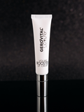 Gerovital Luxury Lip Volume Booster Cream tube on black reflective surface