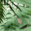 Three Gerovital Plant concealer tubes beside beige swatch and green leaves