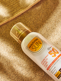 Gerovital Sun Kids Sunscreen Spray Lotion SPF 50 bottle on sand
