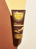 Gerovital Sun Self-Tanning Cream tube on cream and terracotta panels